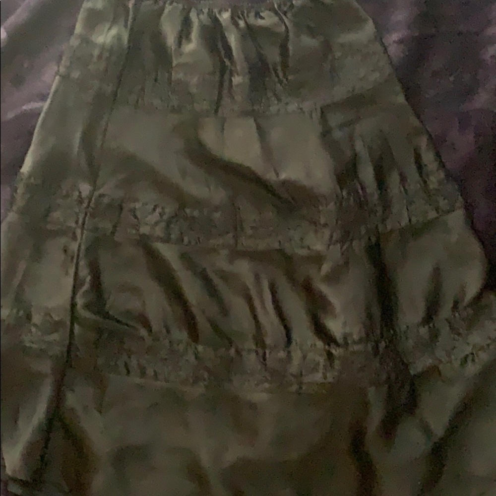 A black embroidered skirt.